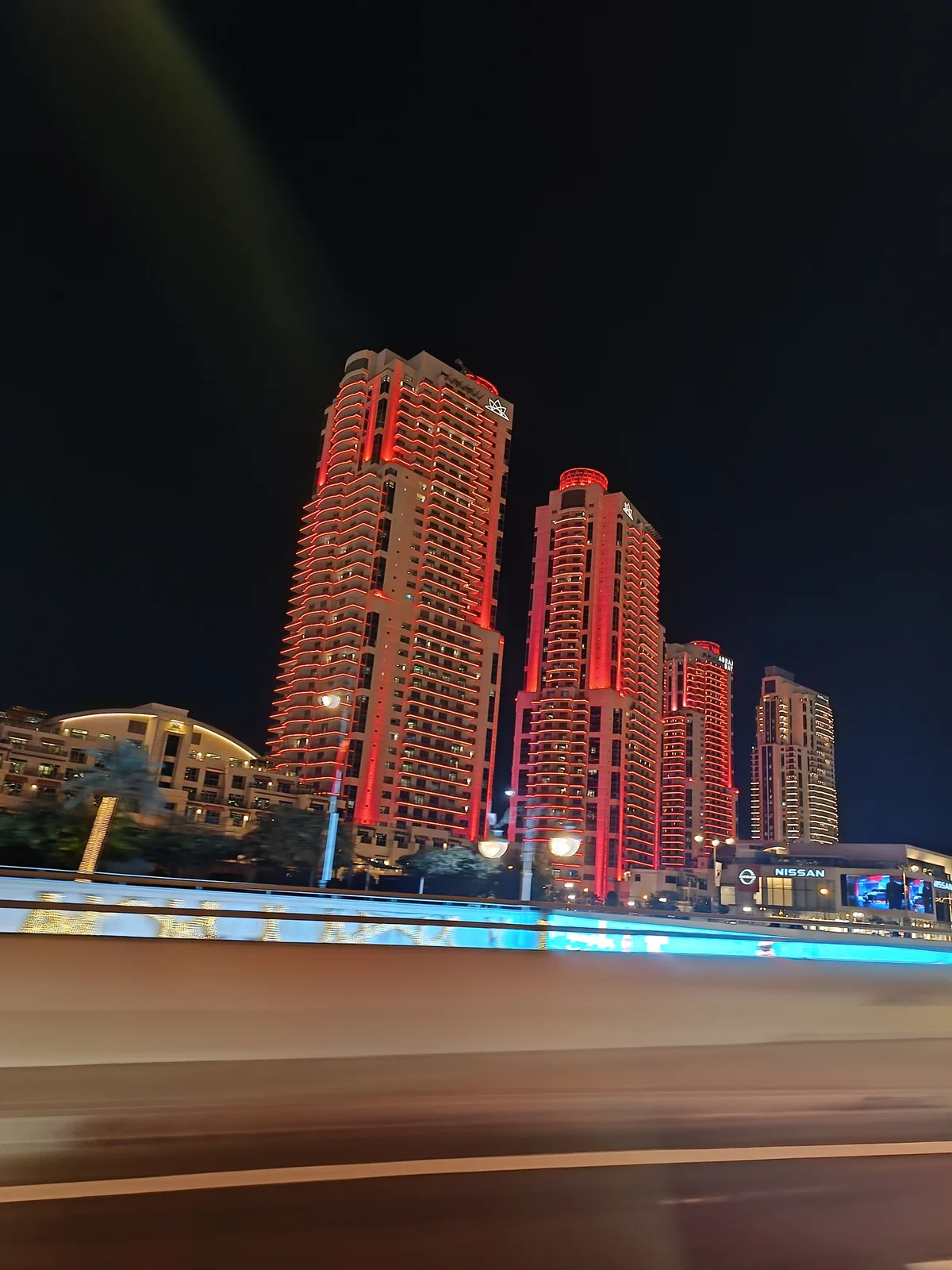 Illuminated skyscrapers at night in Doha, Qatar