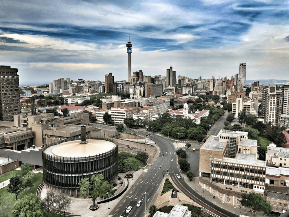 Stereotypes about Africa: Modern skyline of Johannesburg with Sandton Tower and traffic — a thriving African metropolis