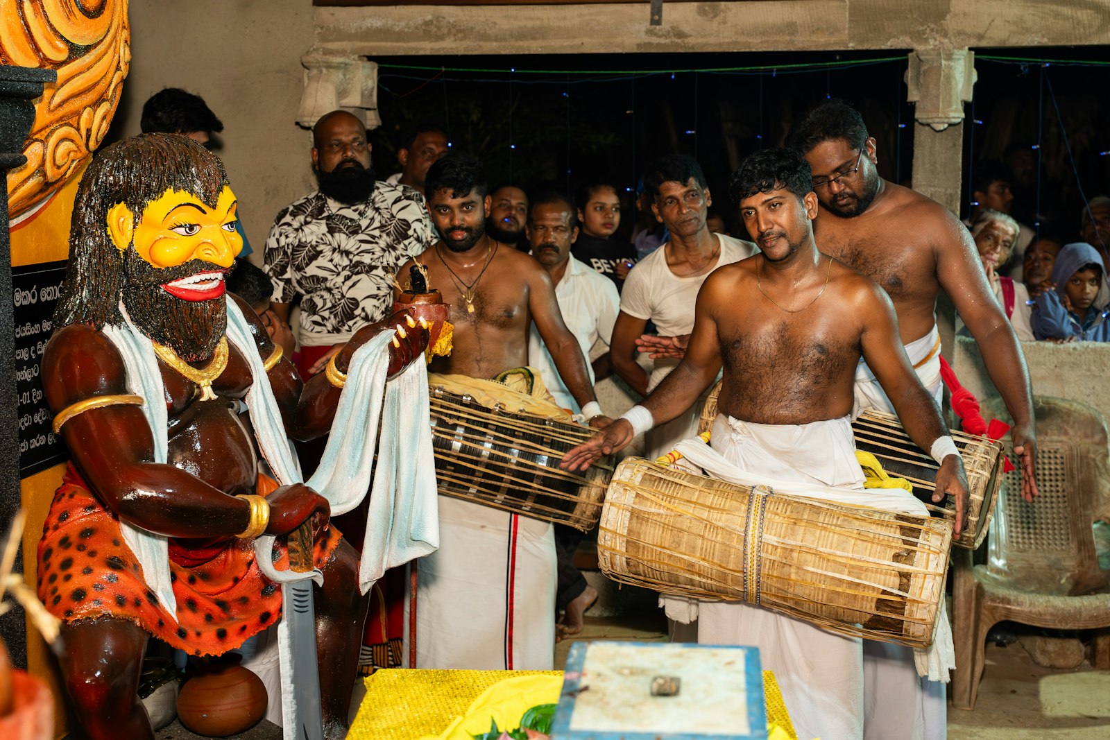 Kandyan dancer and drummer performing traditional rituals linked to the Esala Perahera