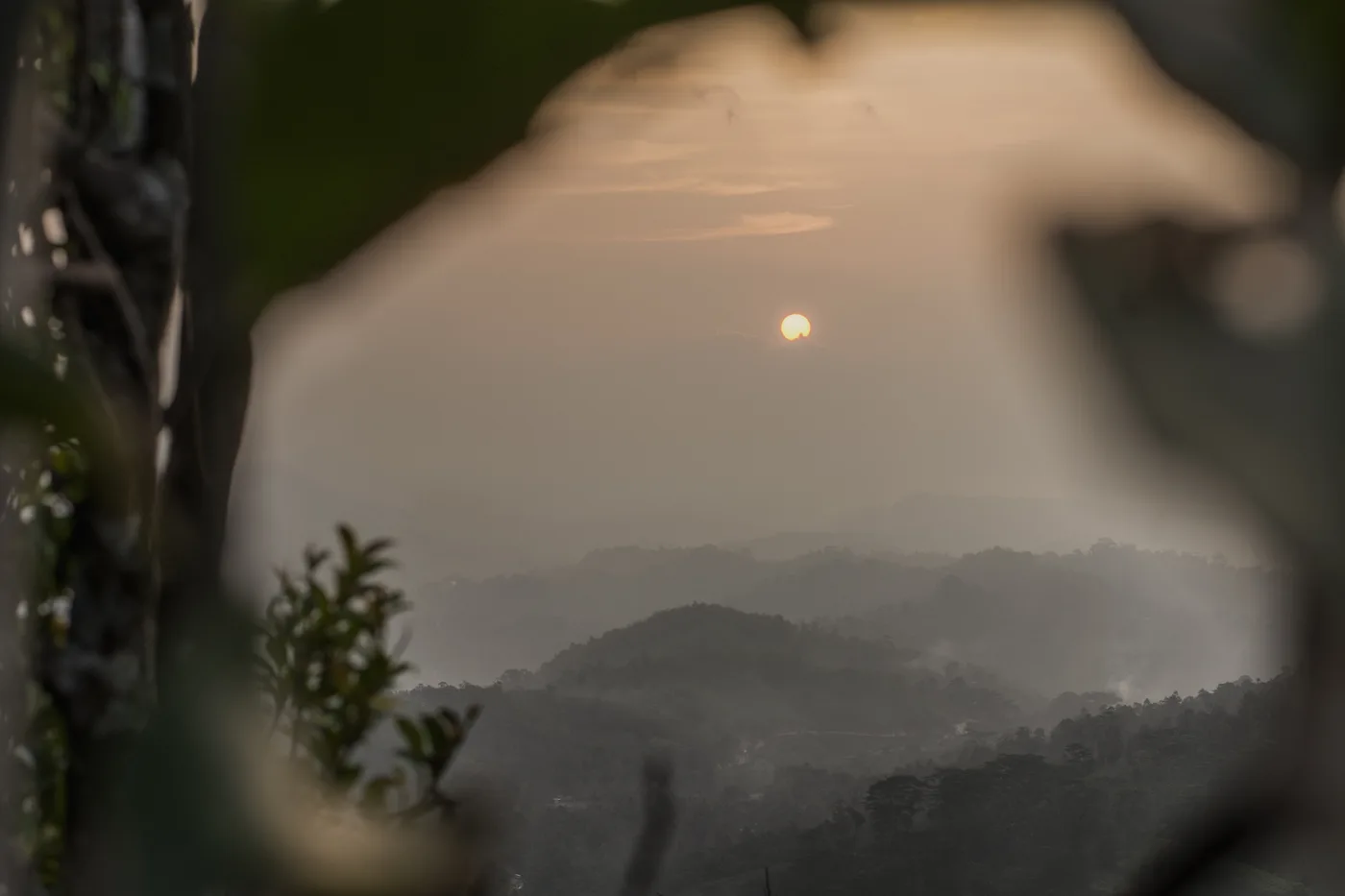 Misty sunrise over tropical hills, the quiet kind of view you get living abroad alone