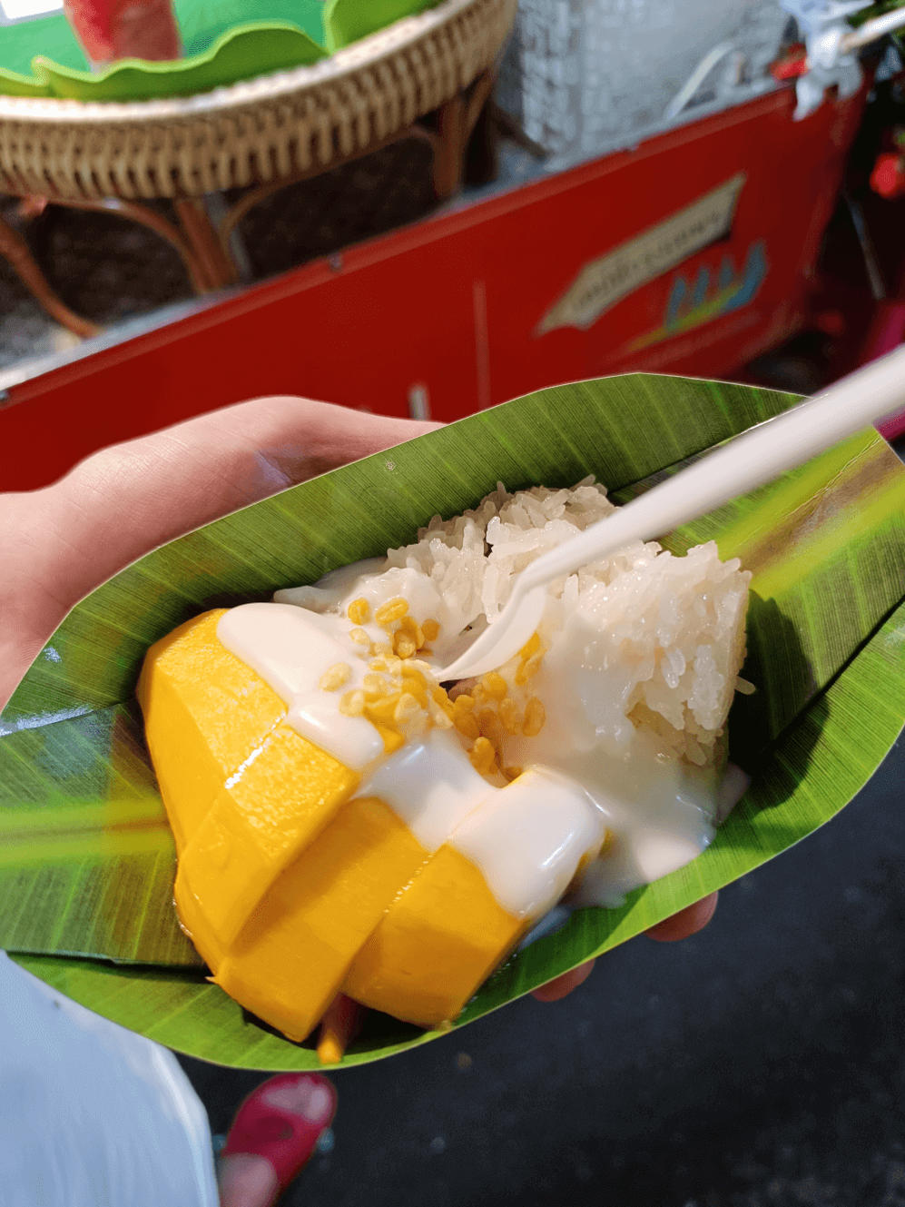 Free things to do in Bangkok: Authentic mango sticky rice served on banana leaf at Or Tor Kor Market