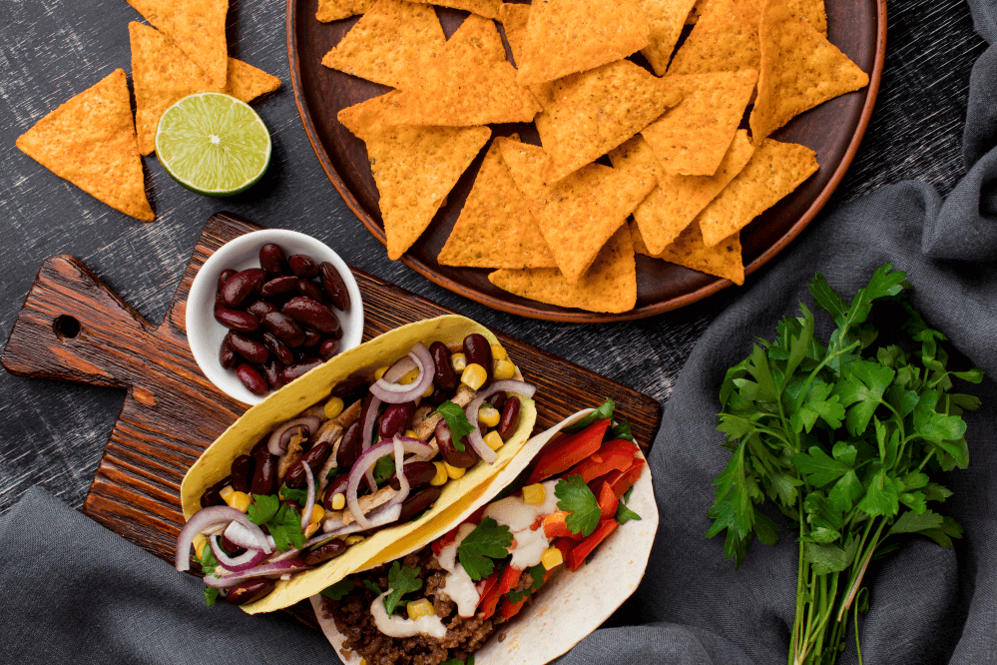 Authentic Mexican tacos with beans, corn, and fresh toppings — a balanced plate that reflects why ‘why is Mexican food so fatty’ is a misunderstood question