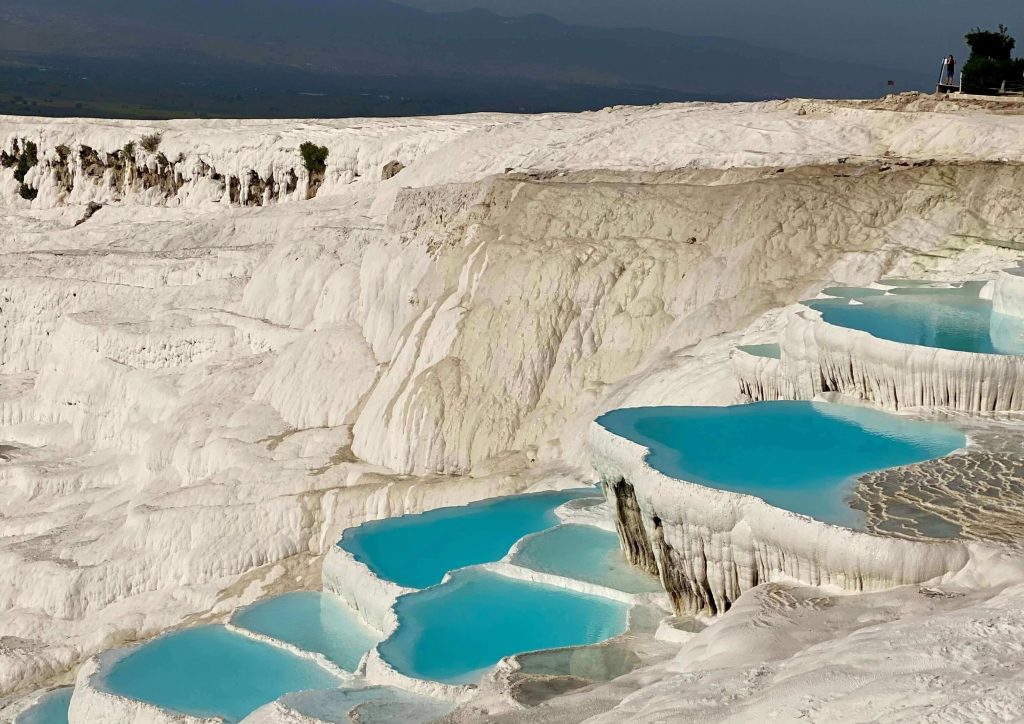 Pamukkale white travertine terraces with turquoise pools – natural wonder and must-see destination in Turkey