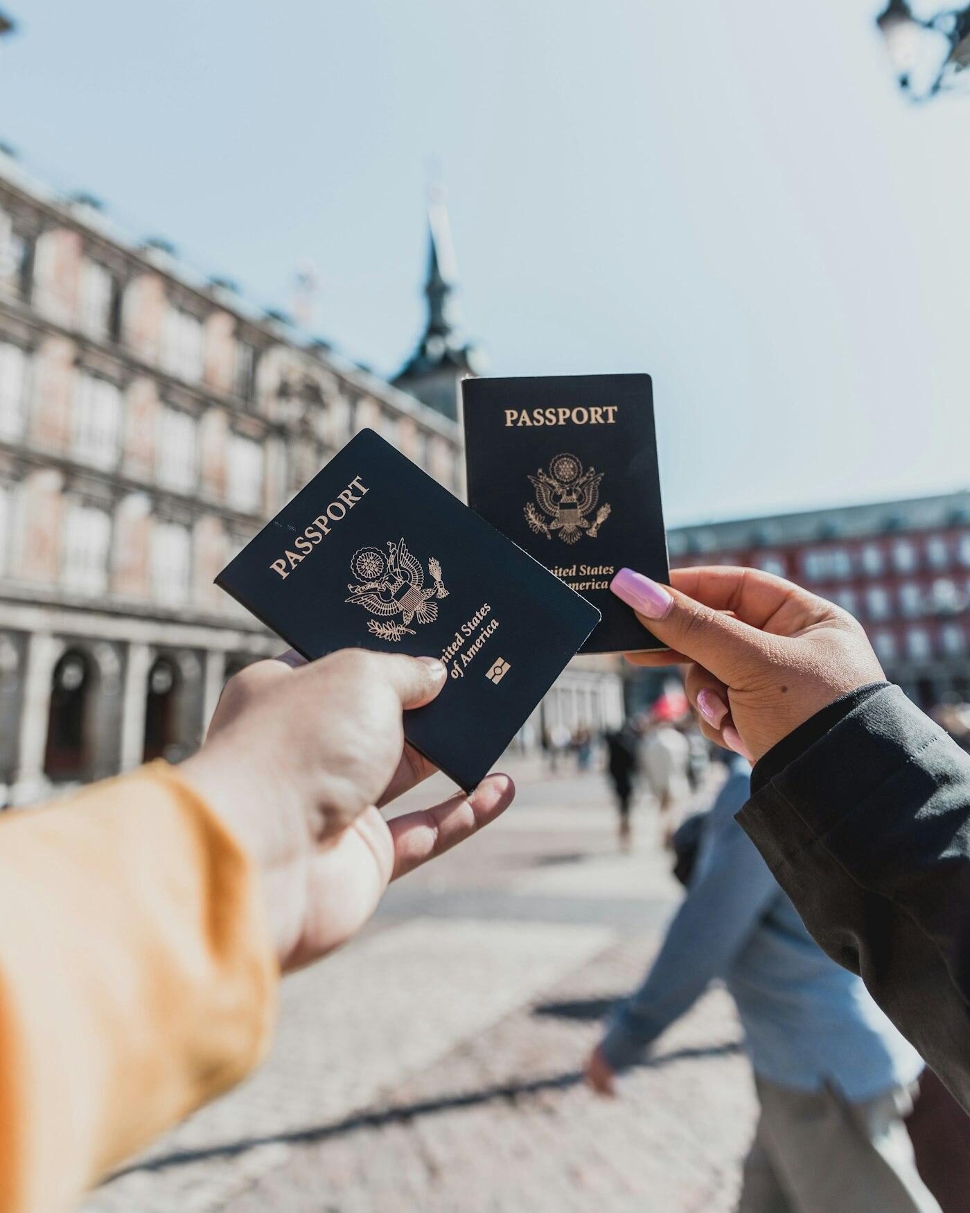 Two passports held up while traveling abroad
