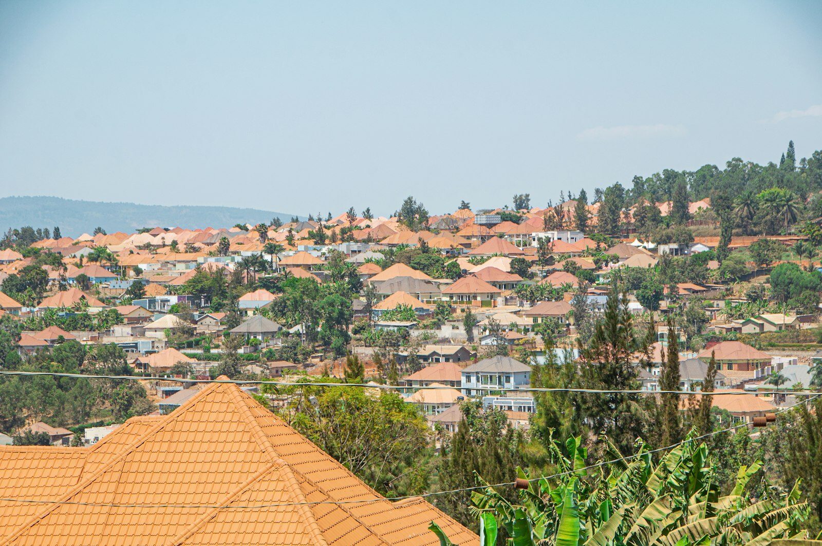 Family travel to Rwanda with kids: view over the green hills and clean streets of Kigali