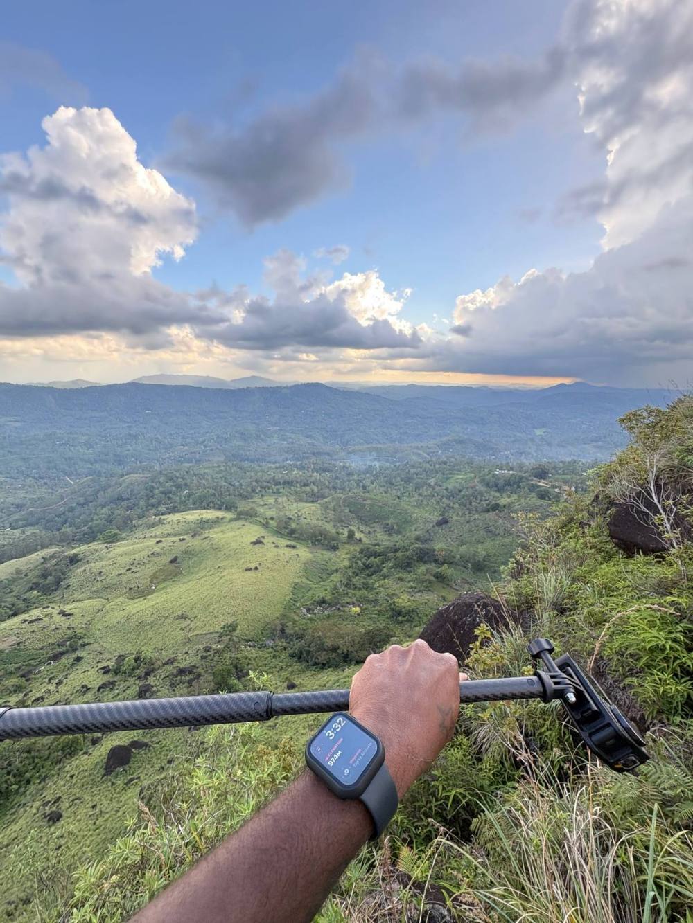 Apple Watch showing 974m elevation at Sinharaja viewpoint with green valley behind