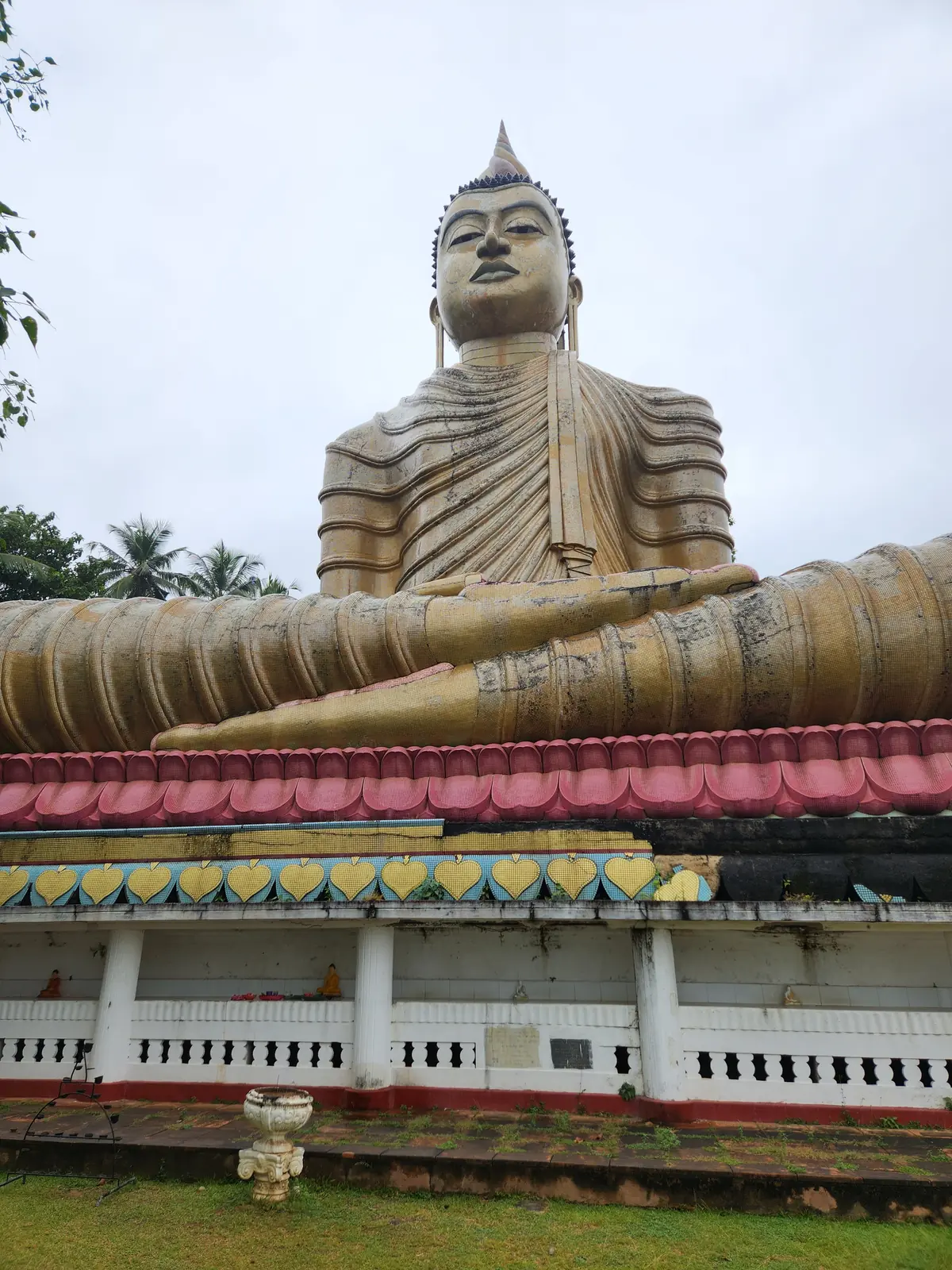 Giant seated Buddha statue at a temple in southern Sri Lanka