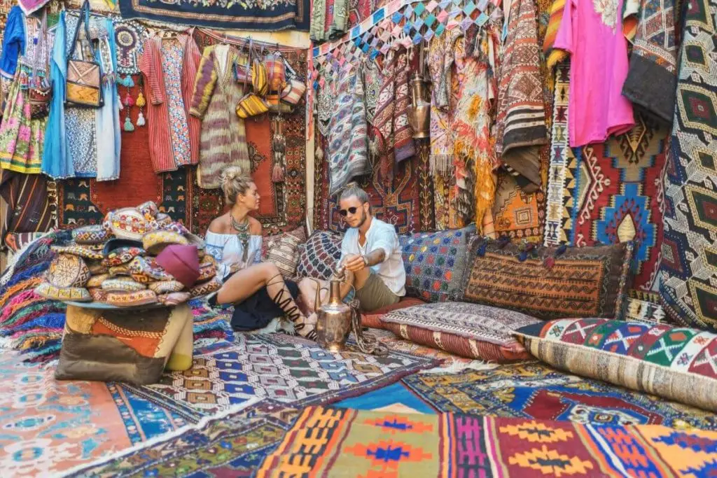 Traditional Turkish bazaar with colorful carpets and textiles – authentic cultural experience in Turkey