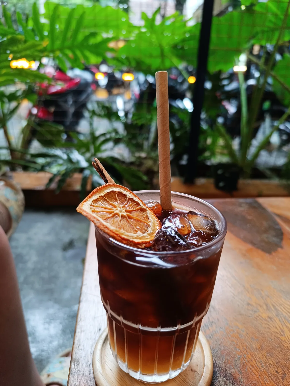 Refreshing Vietnamese iced coffee with orange at a café in Vietnam